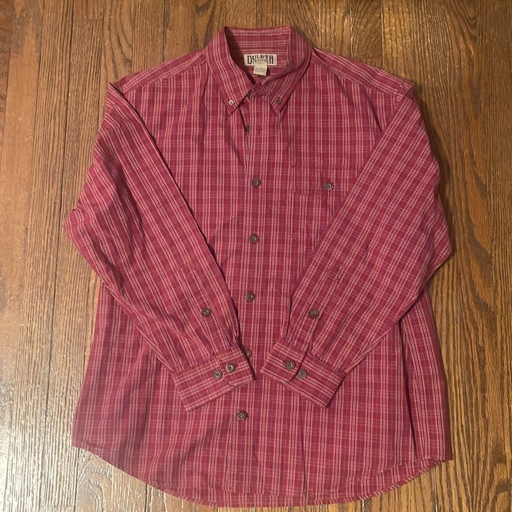 Duluth men’s red, tan,‎ blue stripped —button down.  No Velcro. 100% cotton.